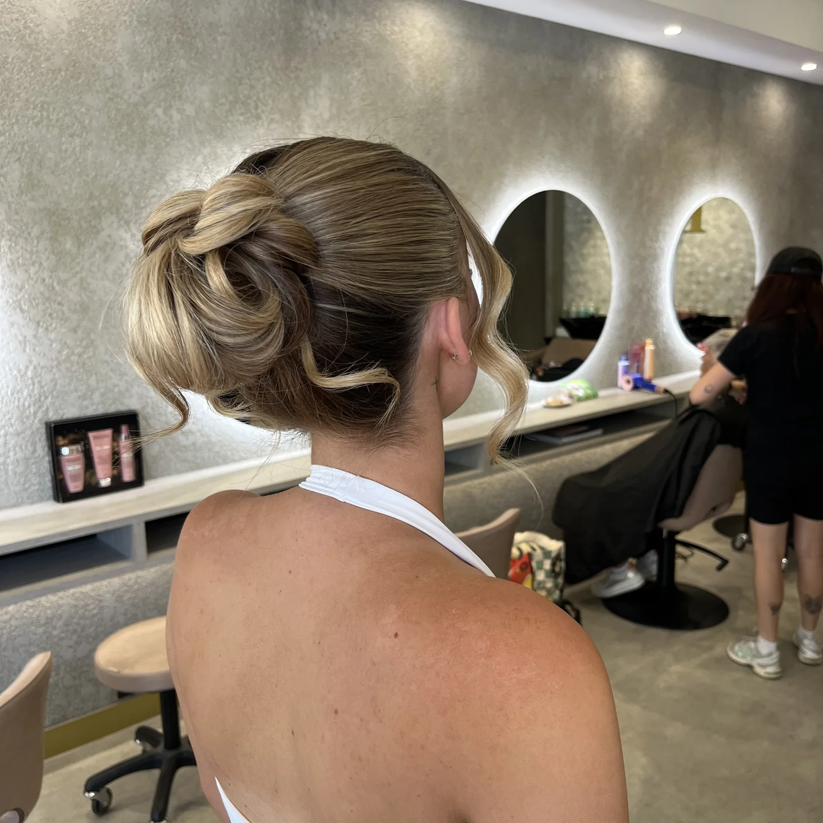 Textured formal low updo, dimensional blonde