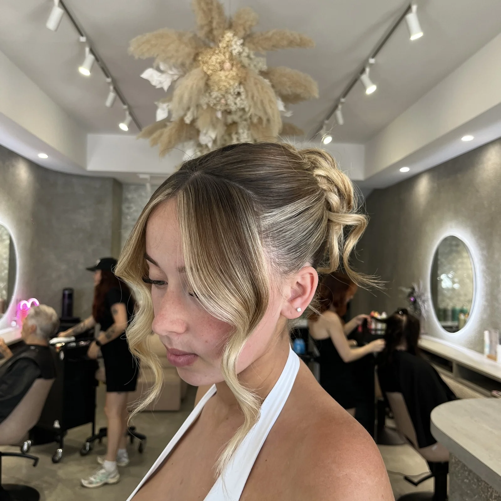 Blonde balayage textured high updo
