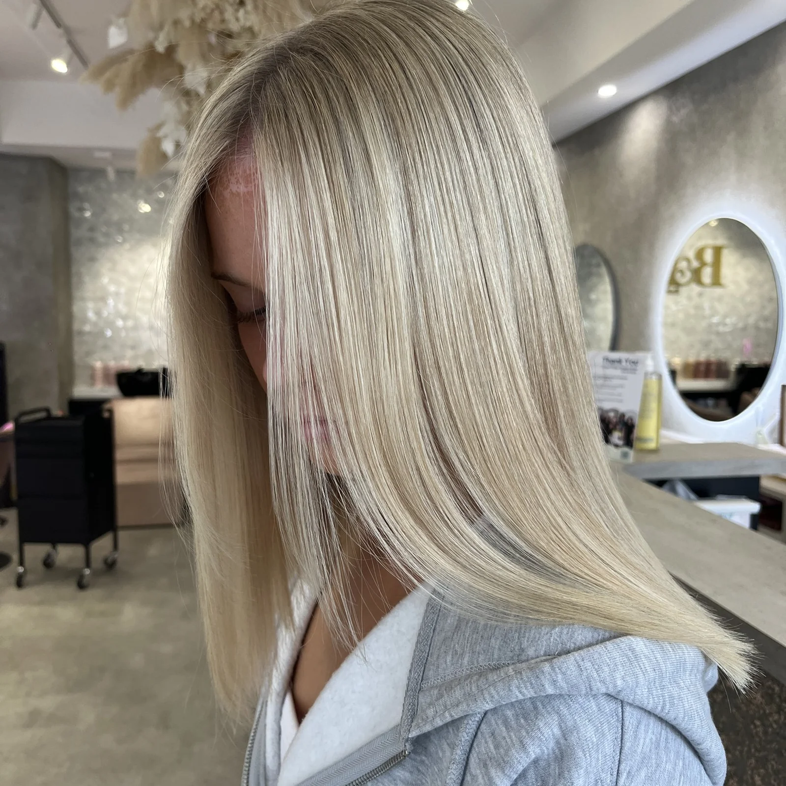 Platinum blonde blunt long bob with shadow root